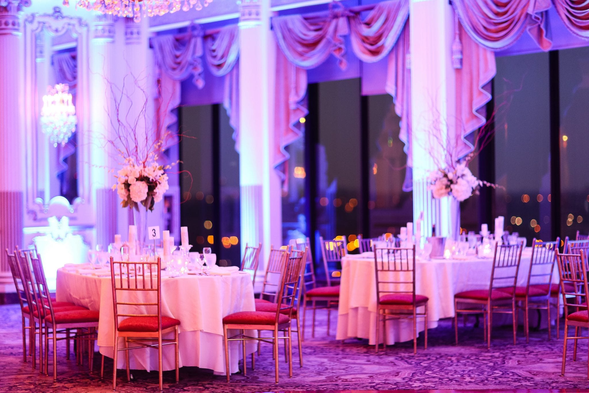 A large ballroom with tables and chairs set up for a wedding reception in Washington DC