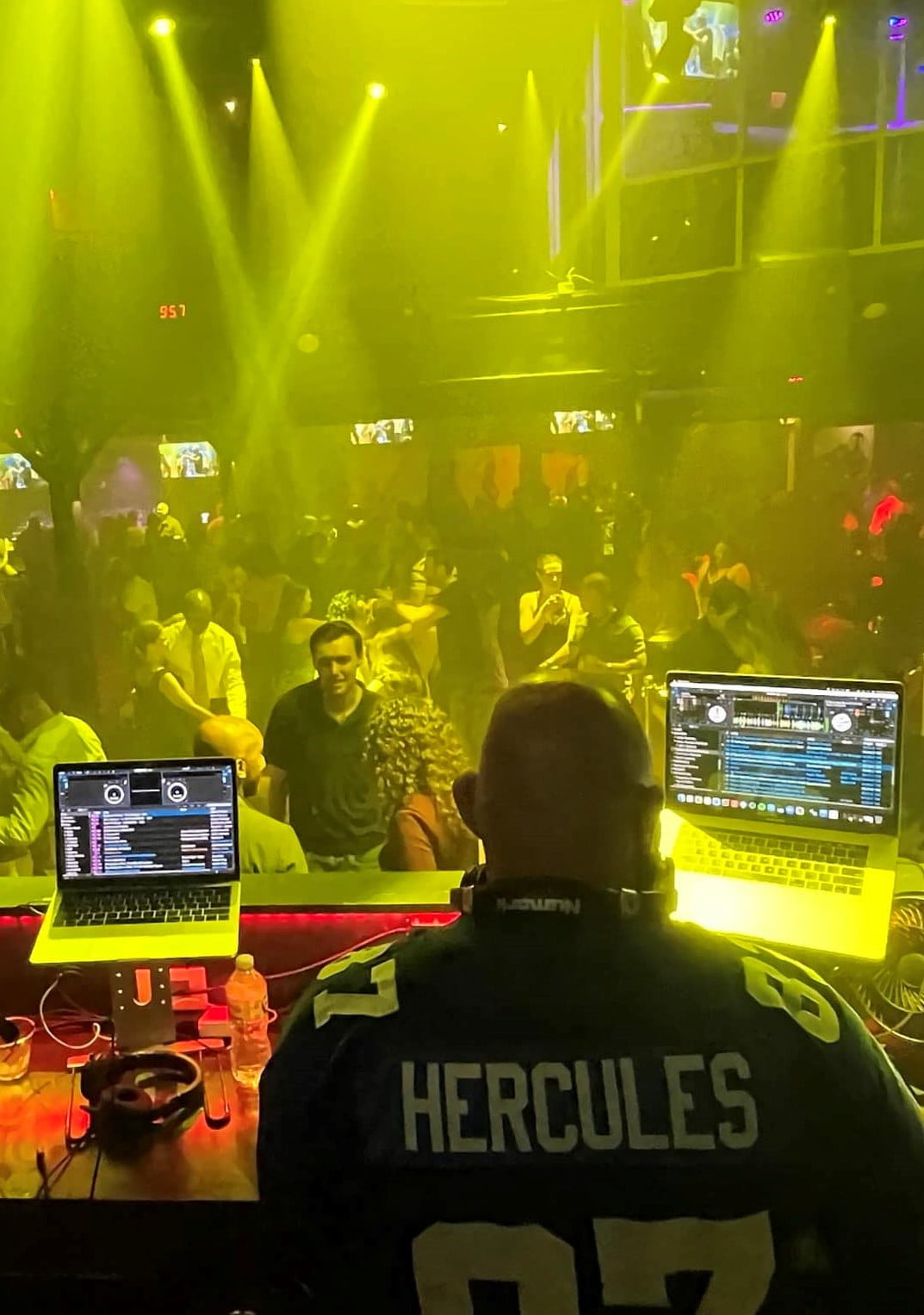 hercules-entertainment-washington-dc-djs A va dj at a nightclub with two laptops in front of him.